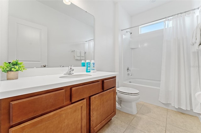 full bathroom featuring vanity, toilet, shower / bath combo with shower curtain, and tile patterned flooring