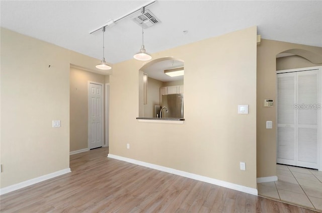 empty room with light wood-type flooring