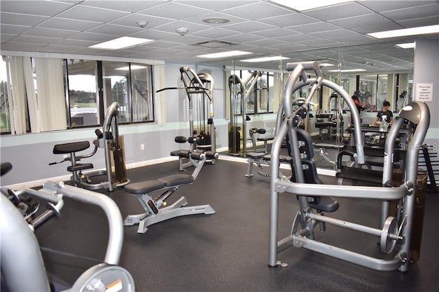 workout area with a paneled ceiling