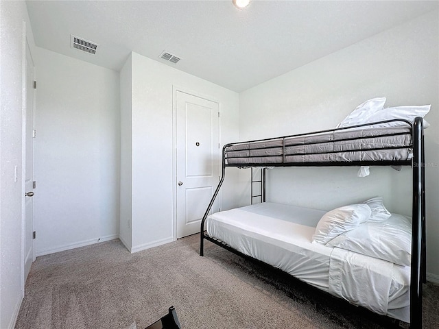 bedroom with light carpet