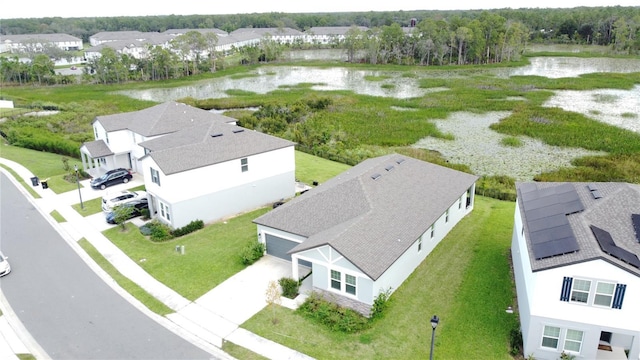 drone / aerial view with a water view