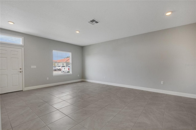 empty room with light tile patterned floors