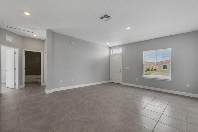 unfurnished room featuring light tile patterned flooring