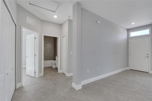 entrance foyer with light tile patterned floors