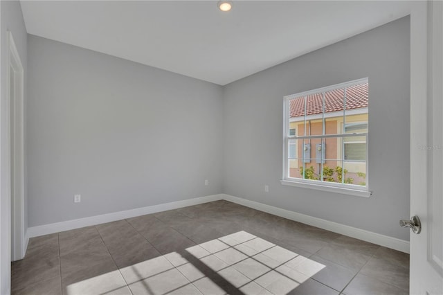 empty room featuring tile patterned floors