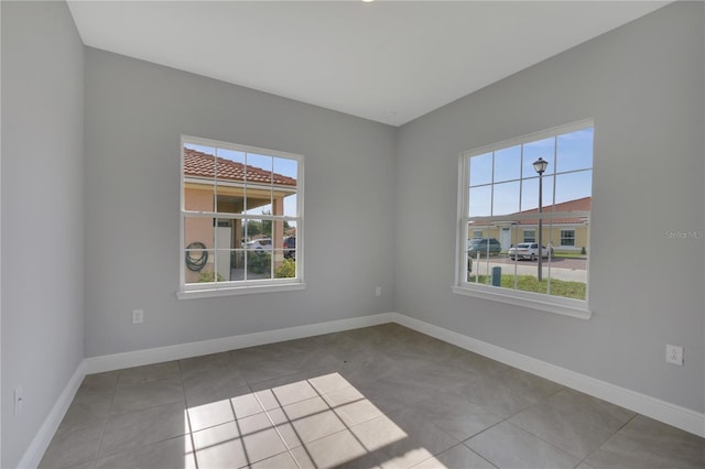 empty room with light tile patterned floors