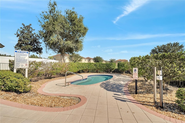 view of swimming pool featuring a patio area