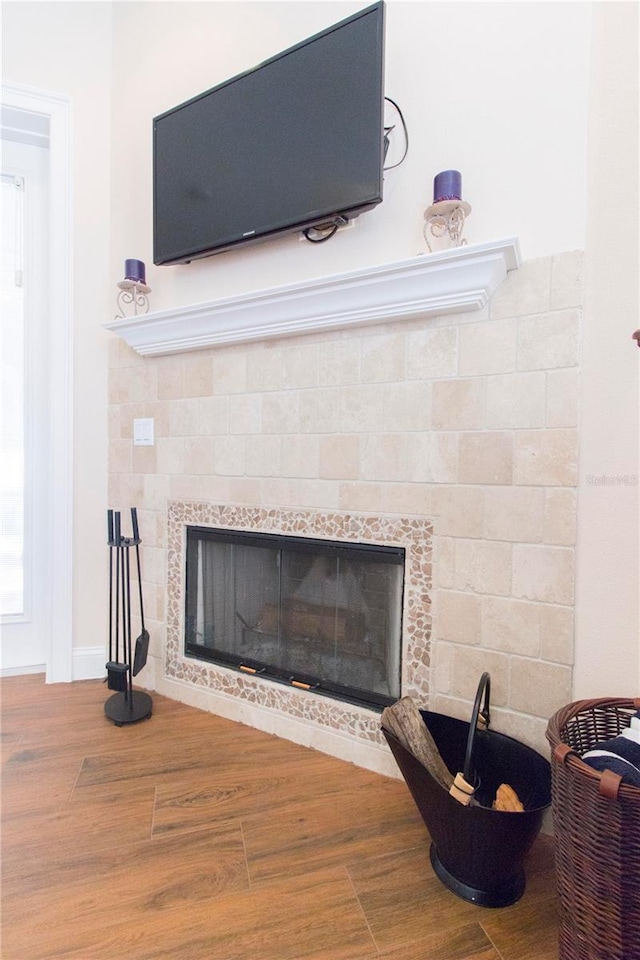 room details with a fireplace and wood-type flooring