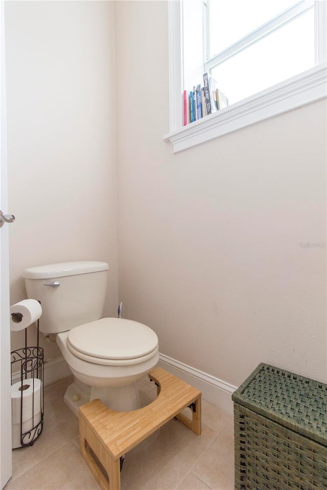 bathroom featuring tile patterned floors and toilet