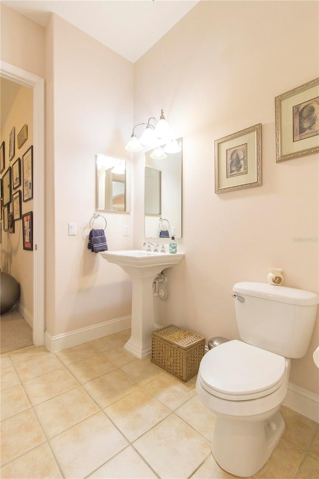 bathroom with tile patterned flooring and toilet