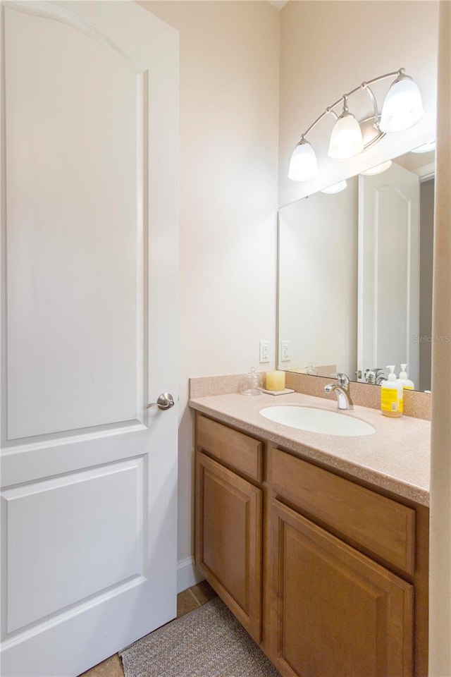 bathroom with tile patterned flooring and vanity