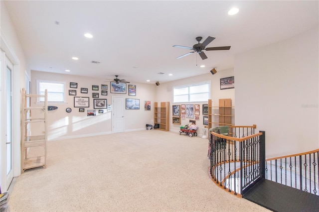 recreation room featuring carpet and ceiling fan