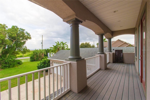 wooden deck with a yard