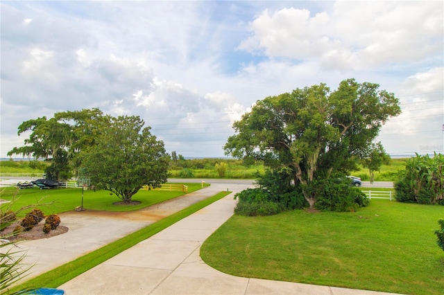 view of home's community featuring a lawn