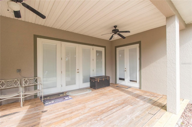 exterior space with a wooden deck, ceiling fan, and french doors