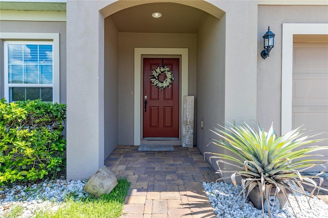 doorway to property featuring a garage