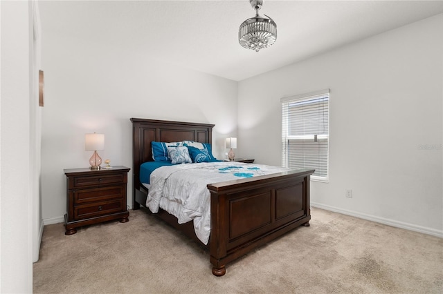 bedroom featuring light carpet