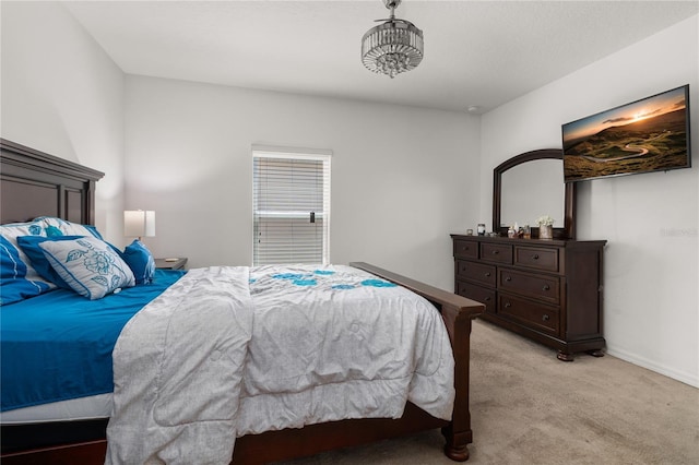 bedroom with light colored carpet