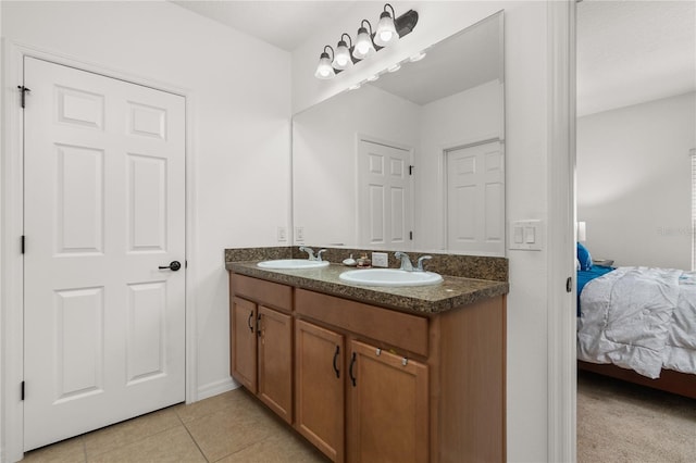 bathroom featuring tile patterned flooring and vanity