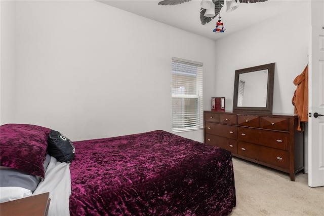 bedroom featuring ceiling fan and light colored carpet