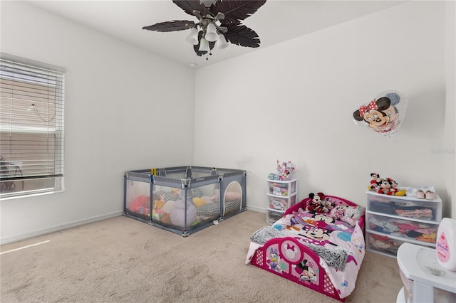 carpeted bedroom with ceiling fan