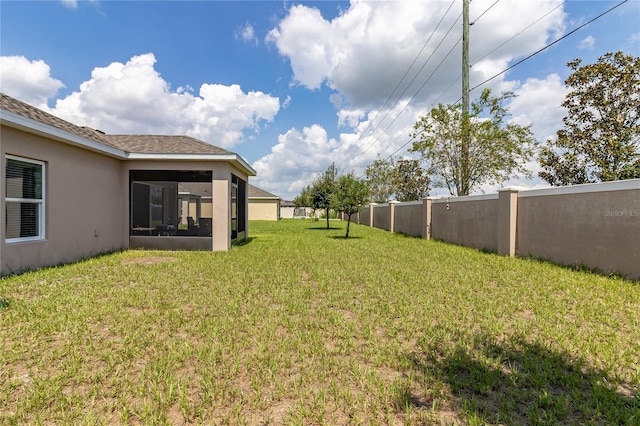 view of yard featuring a sunroom