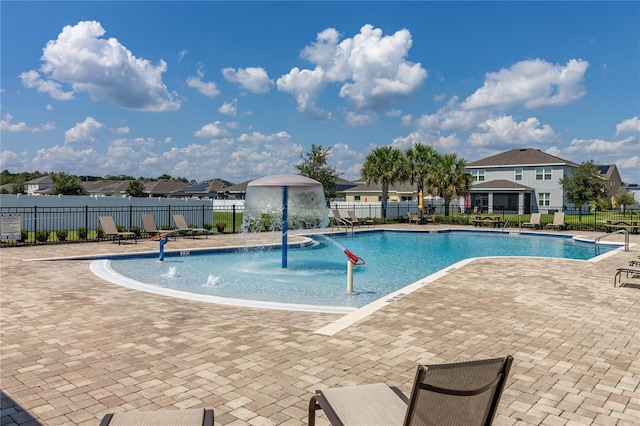 view of swimming pool with a patio area and pool water feature