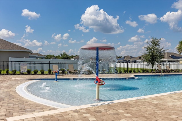 view of swimming pool featuring pool water feature