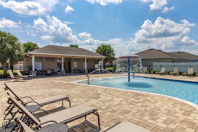 view of swimming pool featuring a patio and pool water feature