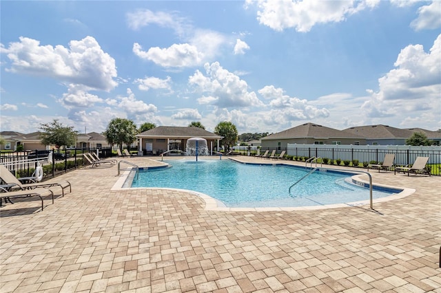 view of swimming pool featuring a patio area and pool water feature