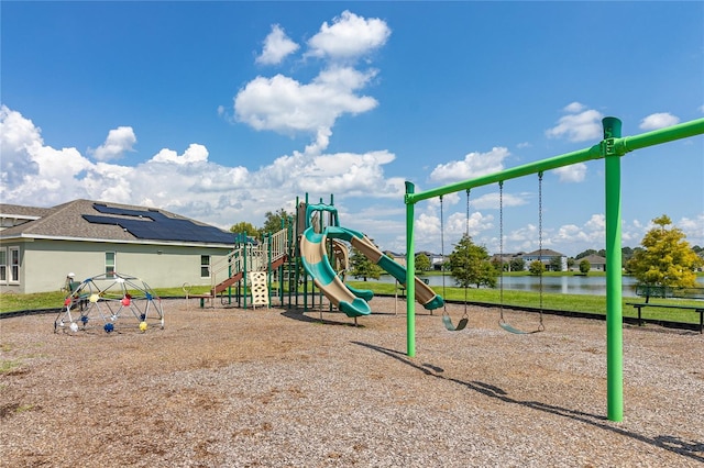 view of jungle gym featuring a water view