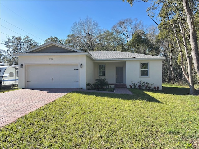 ranch-style home with a garage and a front yard