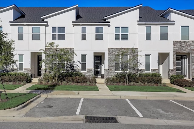 1842 Tropical Palms Cir, Kissimmee, FL 34747 - multi unit property with stone siding, stucco siding, and uncovered parking