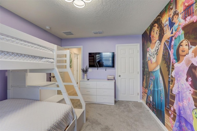 carpeted bedroom featuring a textured ceiling