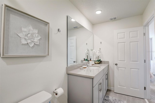 1842 Tropical Palms Cir, Kissimmee, FL 34747 - bathroom with vanity, toilet, and tile patterned floors