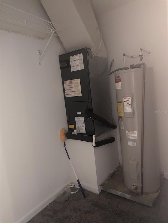 utility room featuring water heater