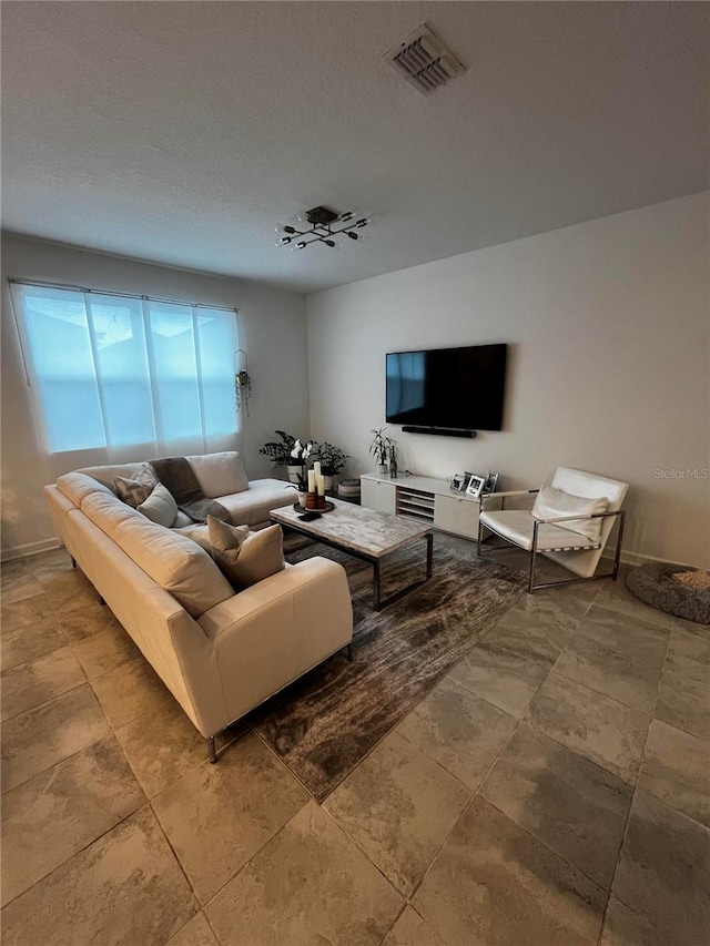 living room featuring a textured ceiling