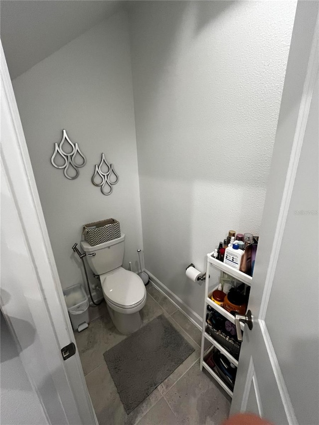 bathroom featuring tile patterned flooring and toilet