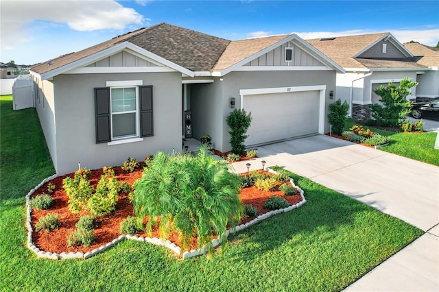 view of front of house featuring a front lawn and a garage