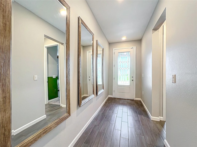 doorway to outside with dark wood-type flooring