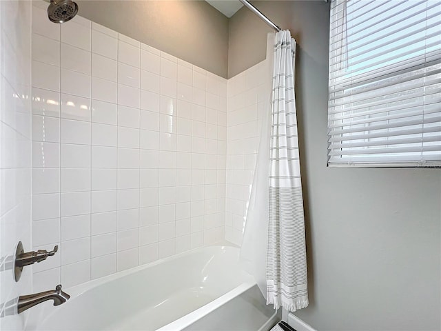 bathroom featuring shower / bath combination with curtain