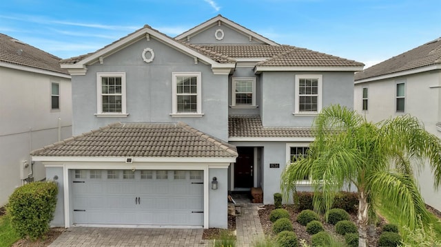 1536 Maidstone Ct, Davenport, FL 33896 - view of front of house featuring stucco siding, driveway, and a tiled roof