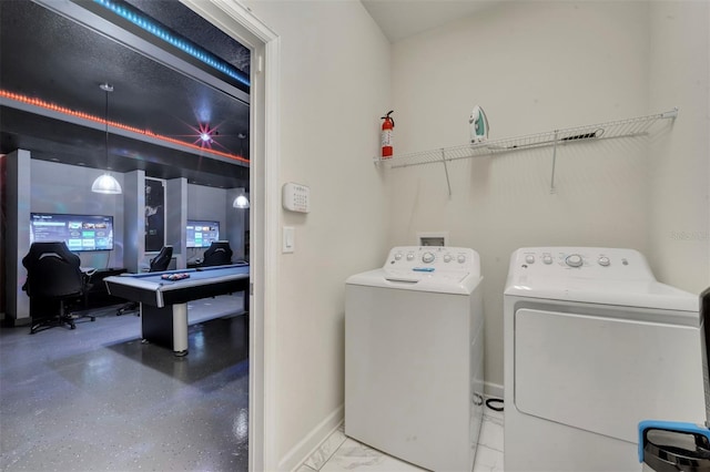 washroom featuring washing machine and clothes dryer