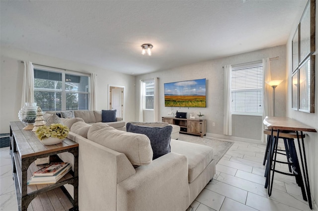 living room with a textured ceiling