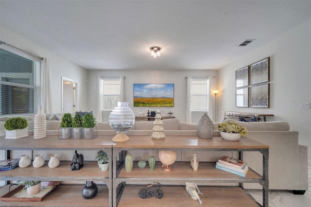 living room with a textured ceiling