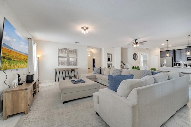 living room featuring ceiling fan