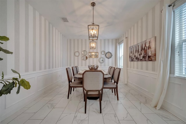 dining room with a notable chandelier