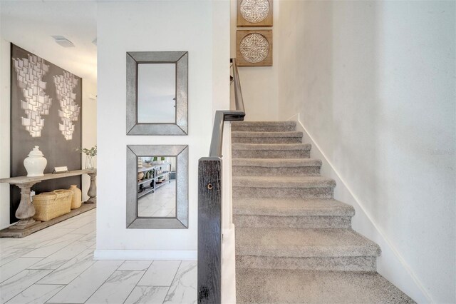 1536 Maidstone Ct, Davenport, FL 33896 - staircase with marble finish floor and baseboards