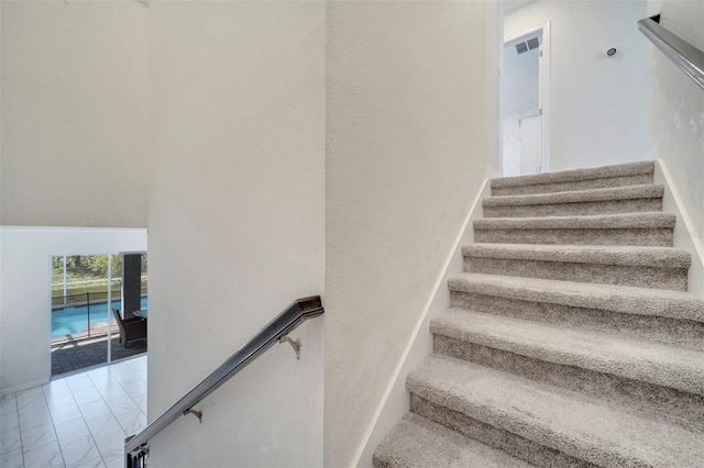 1536 Maidstone Ct, Davenport, FL 33896 - stairs featuring marble finish floor, baseboards, and visible vents
