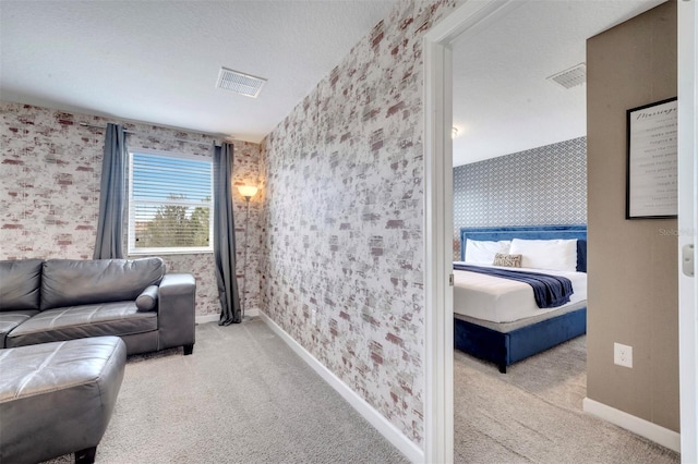 carpeted living room featuring a textured ceiling